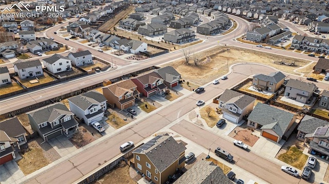 birds eye view of property with a residential view