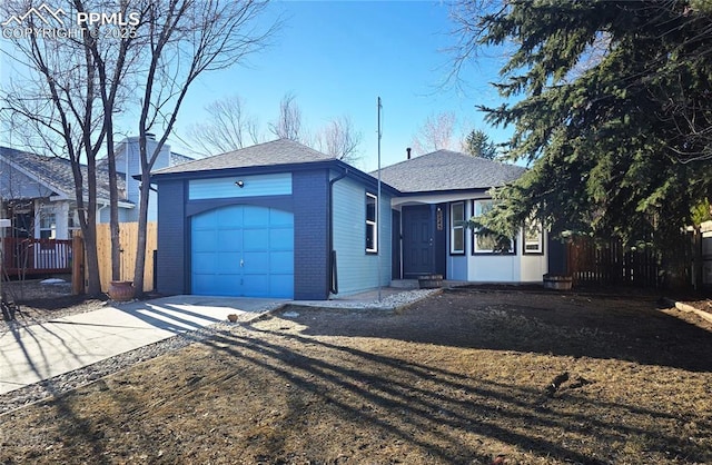 ranch-style house with concrete driveway, brick siding, an attached garage, and fence