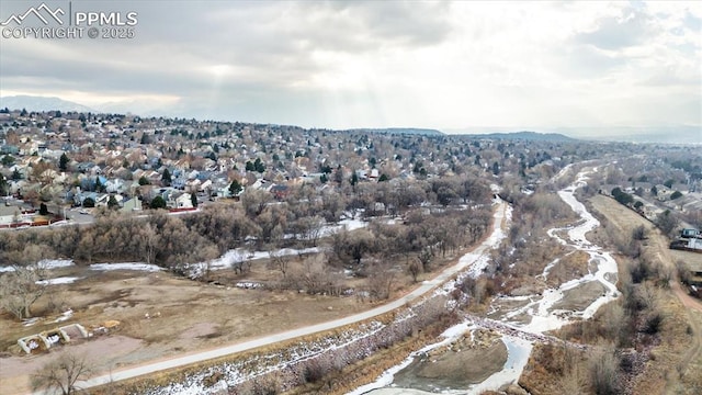 birds eye view of property featuring a mountain view