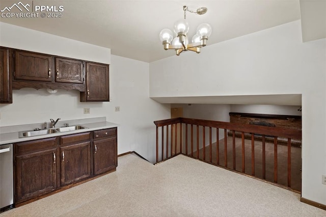 kitchen featuring light countertops, stainless steel dishwasher, an inviting chandelier, a sink, and dark brown cabinetry