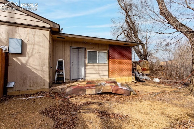 exterior space featuring brick siding