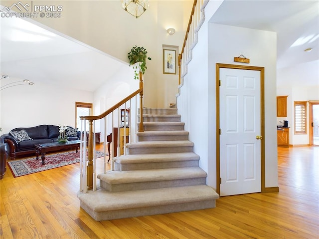 staircase with wood finished floors