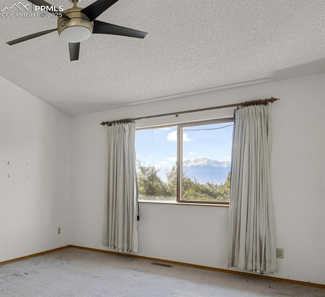 empty room featuring baseboards, visible vents, ceiling fan, a textured ceiling, and carpet floors