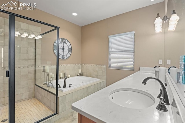 full bath featuring a garden tub, a sink, a shower stall, and double vanity