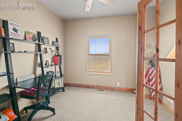 office space with carpet, a ceiling fan, and baseboards