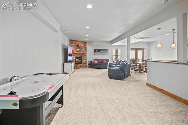 game room with recessed lighting, visible vents, a large fireplace, carpet flooring, and baseboards