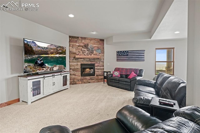 living room featuring baseboards, carpet, a fireplace, and recessed lighting