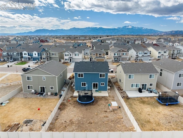 aerial view with a mountain view and a residential view