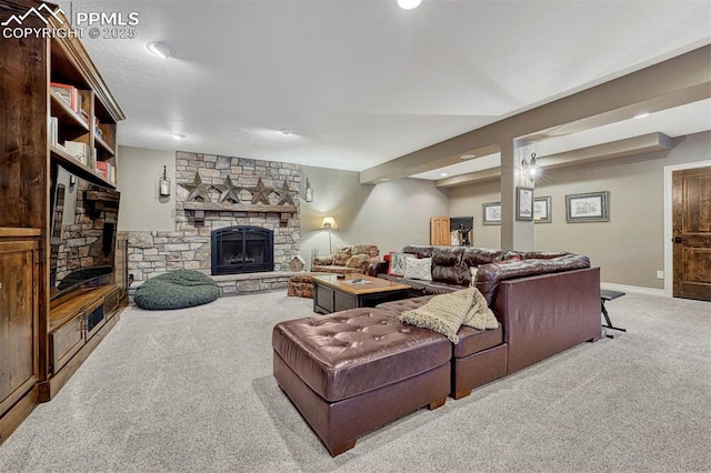 carpeted living room with a stone fireplace and baseboards