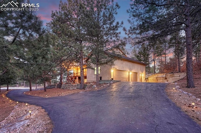 view of front of property with driveway and a garage