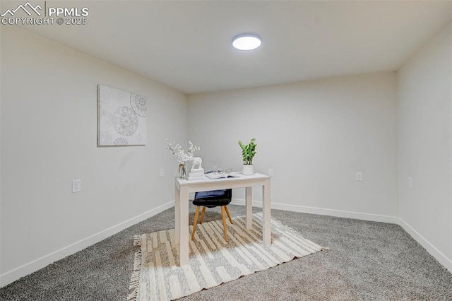 carpeted home office with baseboards