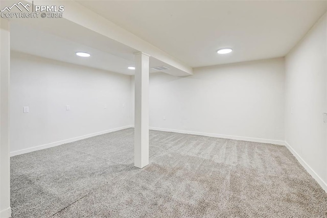 finished basement featuring carpet floors, baseboards, and recessed lighting