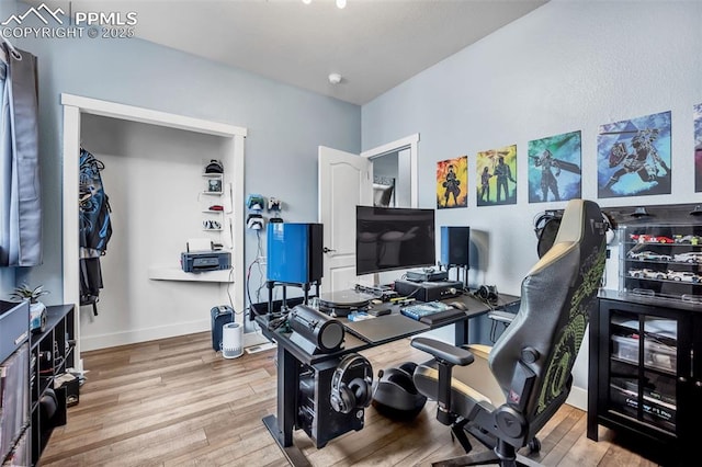 office area featuring baseboards and wood finished floors