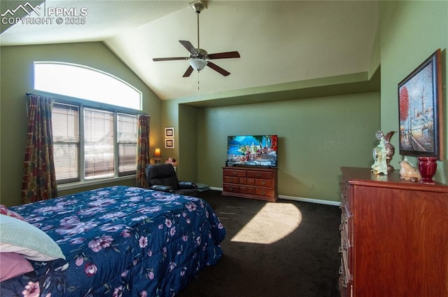 bedroom with lofted ceiling, ceiling fan, dark carpet, and baseboards