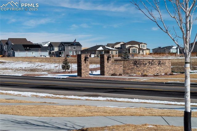 view of street with sidewalks and a residential view