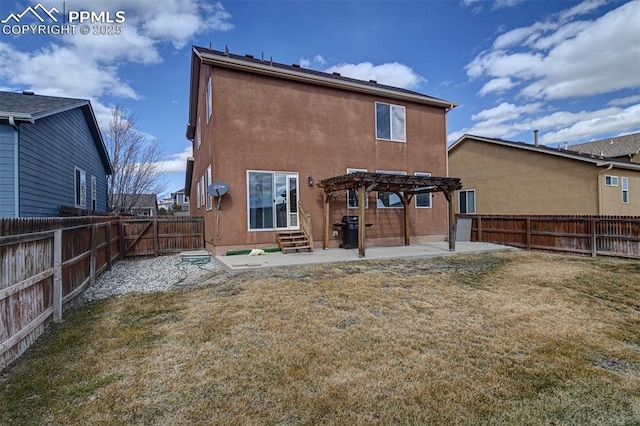 back of house with a patio, stucco siding, entry steps, a pergola, and a fenced backyard