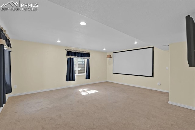 home theater room featuring light carpet, baseboards, and recessed lighting