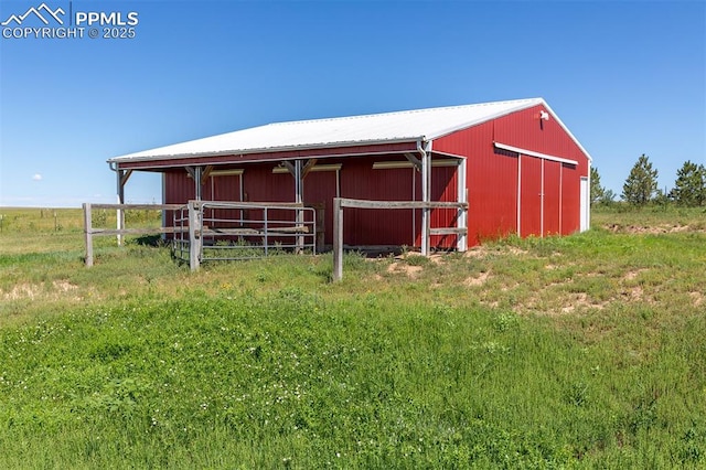 view of outdoor structure with a rural view, an outdoor structure, and an exterior structure