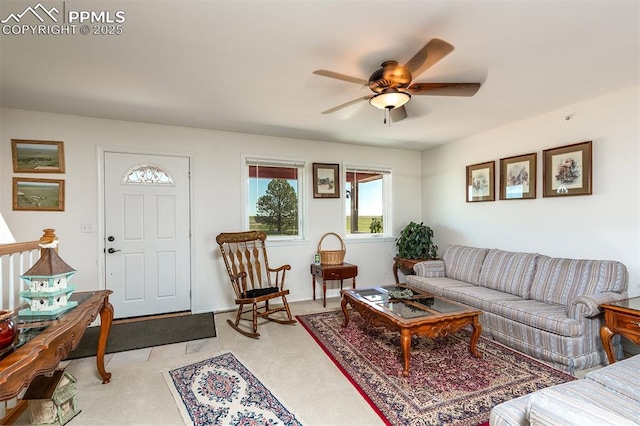 living area featuring ceiling fan and light carpet