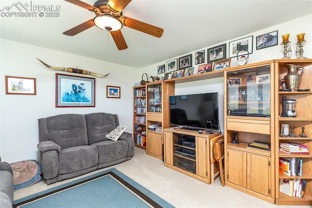 living room featuring ceiling fan and light colored carpet