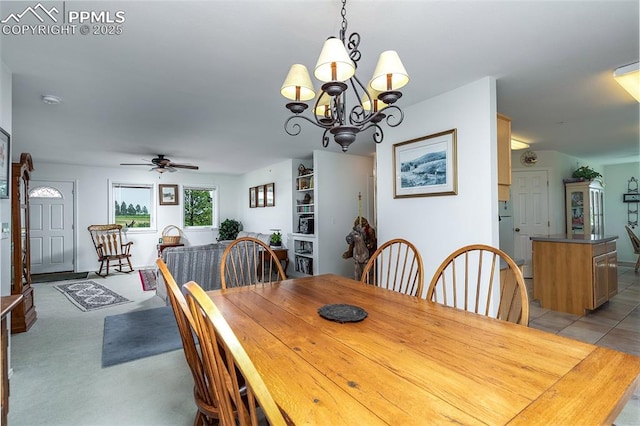 dining room featuring ceiling fan with notable chandelier