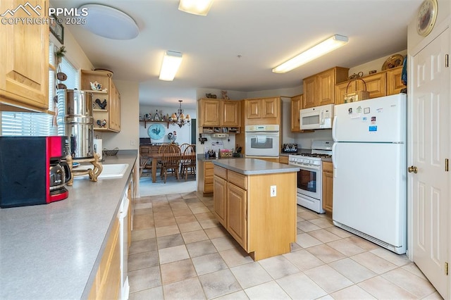 kitchen with white appliances, light countertops, a kitchen island, and light tile patterned floors