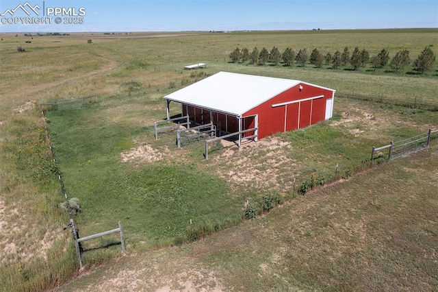 view of pole building featuring a carport and a rural view