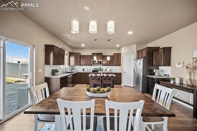 dining space featuring visible vents, recessed lighting, and light wood-style floors