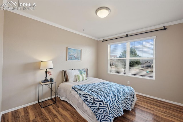 bedroom featuring ornamental molding, dark wood-style flooring, and baseboards