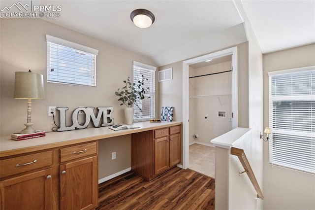 interior space with hookup for a washing machine, hookup for an electric dryer, laundry area, visible vents, and plenty of natural light