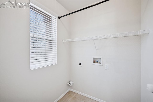 clothes washing area featuring laundry area, a wealth of natural light, washer hookup, and electric dryer hookup