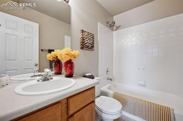 bathroom featuring toilet, bathing tub / shower combination, and vanity