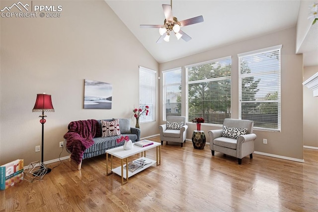 living room with high vaulted ceiling, wood finished floors, a ceiling fan, and baseboards