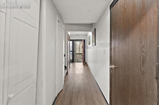 corridor with wood finished floors