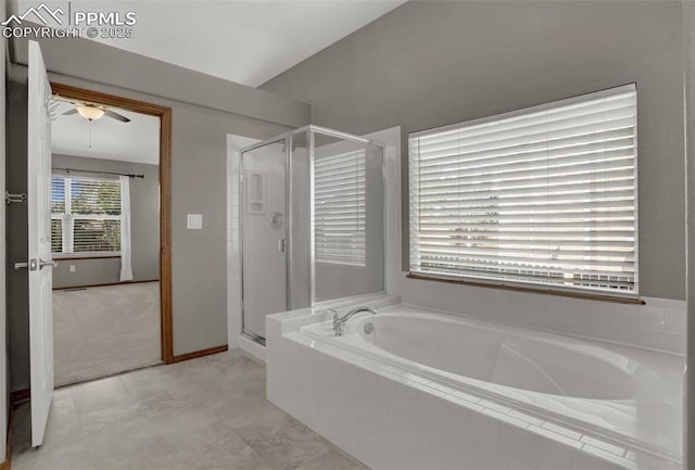 full bath with a garden tub, a shower stall, vaulted ceiling, and a ceiling fan