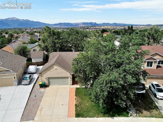 birds eye view of property with a residential view and a mountain view