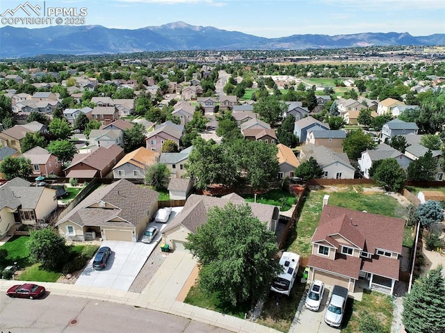 birds eye view of property with a residential view and a mountain view