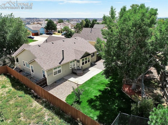 birds eye view of property with a residential view