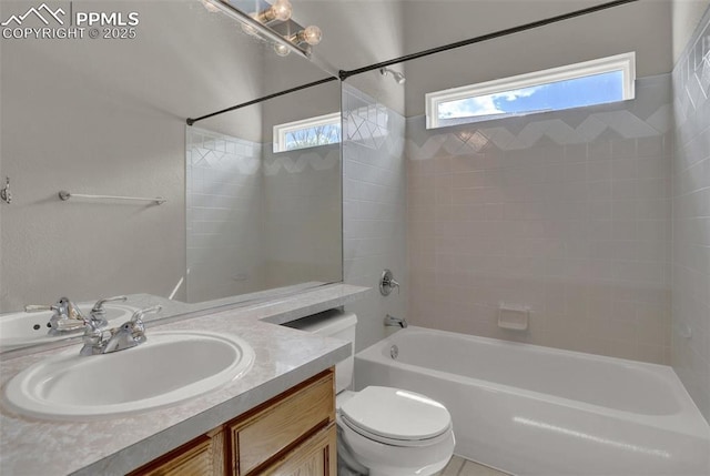 bathroom featuring shower / bath combination, vanity, toilet, and a healthy amount of sunlight