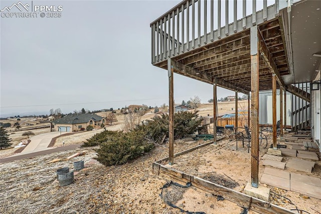 view of yard with fence and a wooden deck