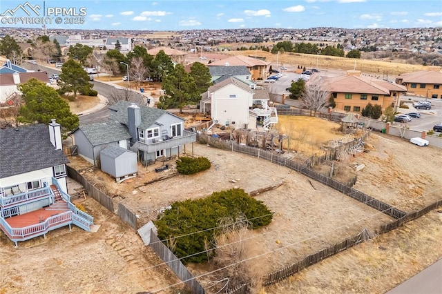 birds eye view of property with a residential view