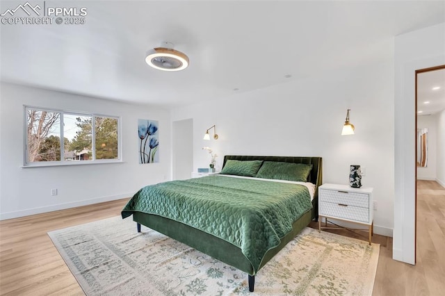 bedroom featuring recessed lighting, light wood-type flooring, and baseboards