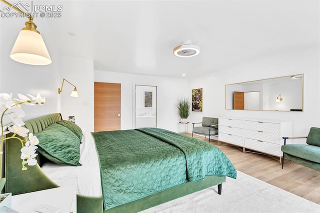 bedroom featuring wood finished floors