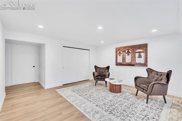 sitting room featuring recessed lighting, baseboards, and light wood finished floors