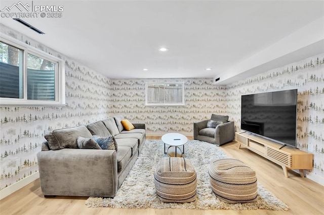 living room featuring baseboards, recessed lighting, wood finished floors, and wallpapered walls