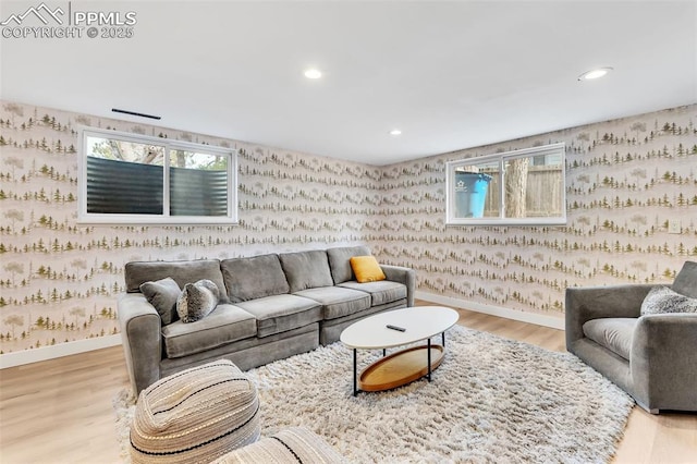 living room with light wood-type flooring, recessed lighting, baseboards, and wallpapered walls