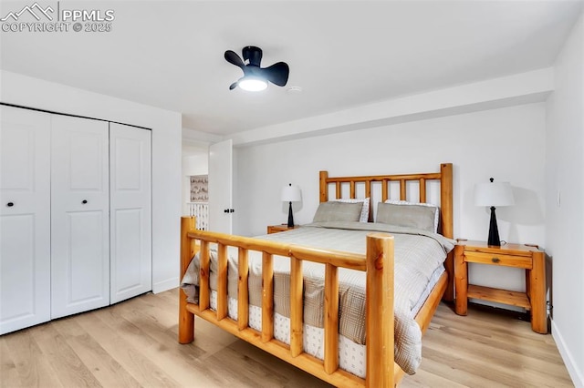 bedroom featuring light wood-type flooring and a closet