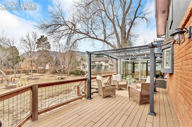 wooden terrace with an outdoor hangout area, a mountain view, and a pergola