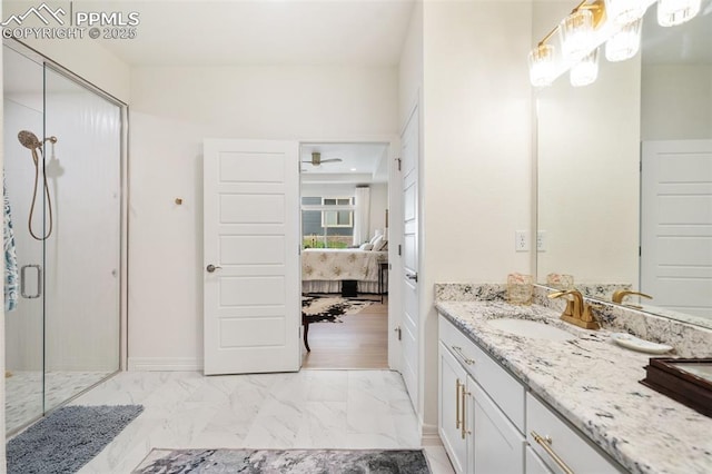 ensuite bathroom with vanity, baseboards, marble finish floor, a stall shower, and ensuite bath