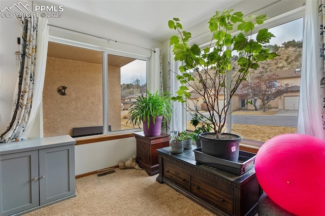 interior space featuring visible vents and plenty of natural light